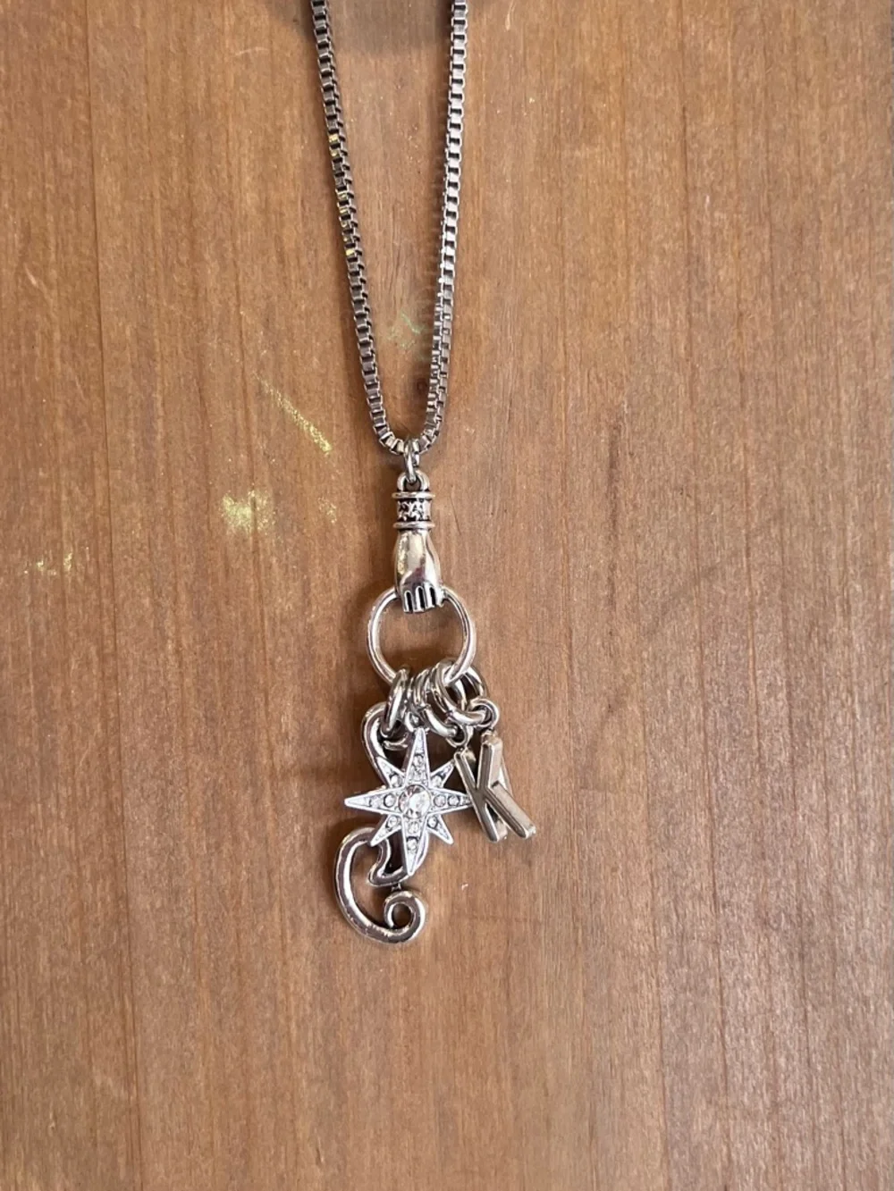 Monk DND necklace with the wind, a star, and KI Dungeons and Dragons jewelry